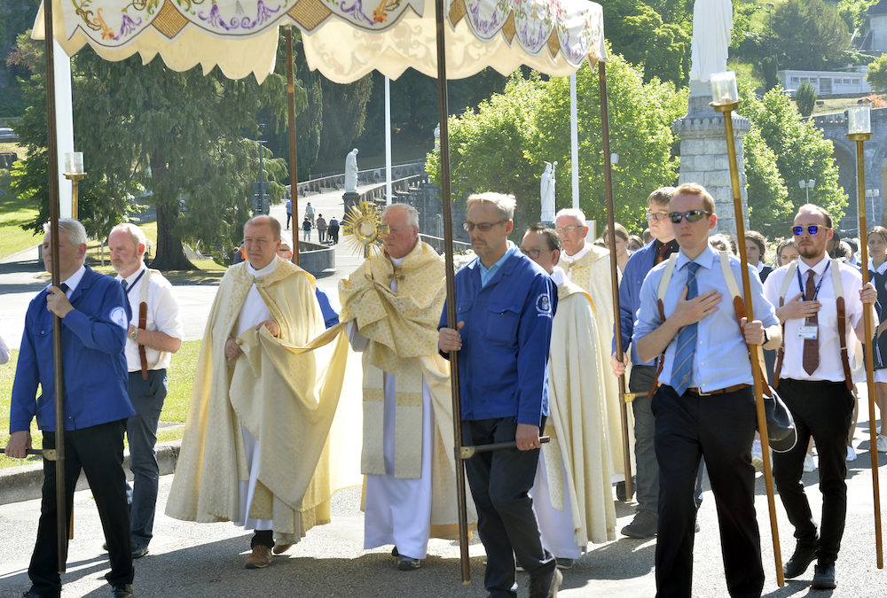 Bishop Terry carrying the Blessed Sacrament – Photo courtesy of Lacaze, Lourdes.jpg