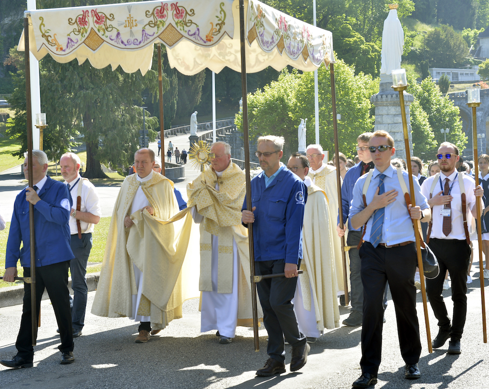 Bishop Terry carrying the Blessed Sacrament – Photo courtesy of Lacaze, Lourdes.jpg