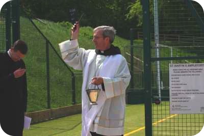photo of Abbot Madden blessing the new pitch