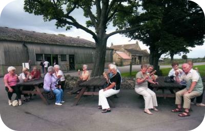 photo of some of the group sitting outside to enjoy their ice cream