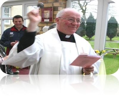photo of Canon Loughlin blessing the new facility