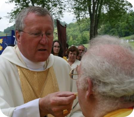 photo of Bishop giving Communion