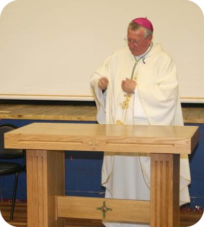 photo of Bishop Terry blessing a new altar