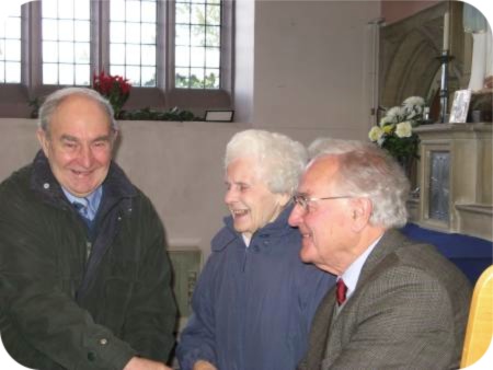 photo of Harry Hargrave and Margaret Dandy congratulating Dennis