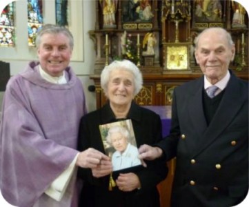 photo of Mary and Tom Catnach with Father Michael Keogh