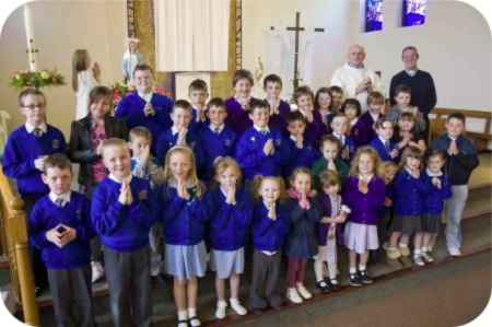 photo of children with Canon Eddie Gubbins and Deacon Pat Thomas