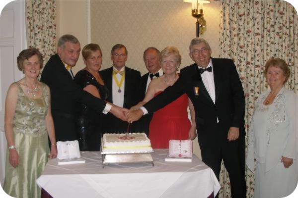 photo of the cutting of the anniversary cake