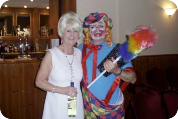 photo of Biddy O'Brien as Dusty Springfield and Brian Gibbs as a clown