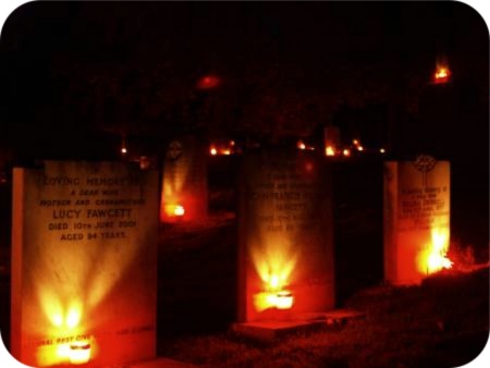 photo of candles at graves at dusk in Ampleforth