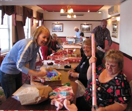 photo of Ellen Timney Foundation supporters wrapping Christmas gifts