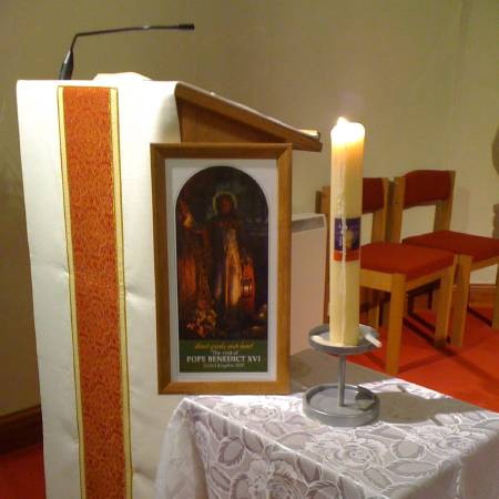 photo of 'Light of the World' picture and candle in Yarm church