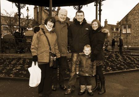 photo of John Gentle and his family in front of the bandstand
