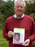 photo of Bishop Terry Drainey with CAFOD leaflet