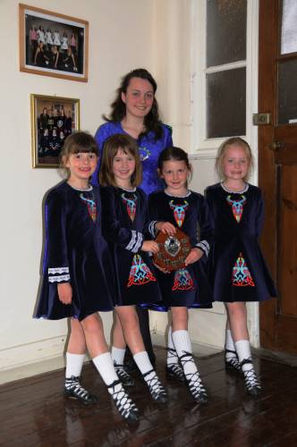 photo of young Irish Dancers and their teacher