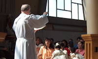 photo a priest giving a blessing