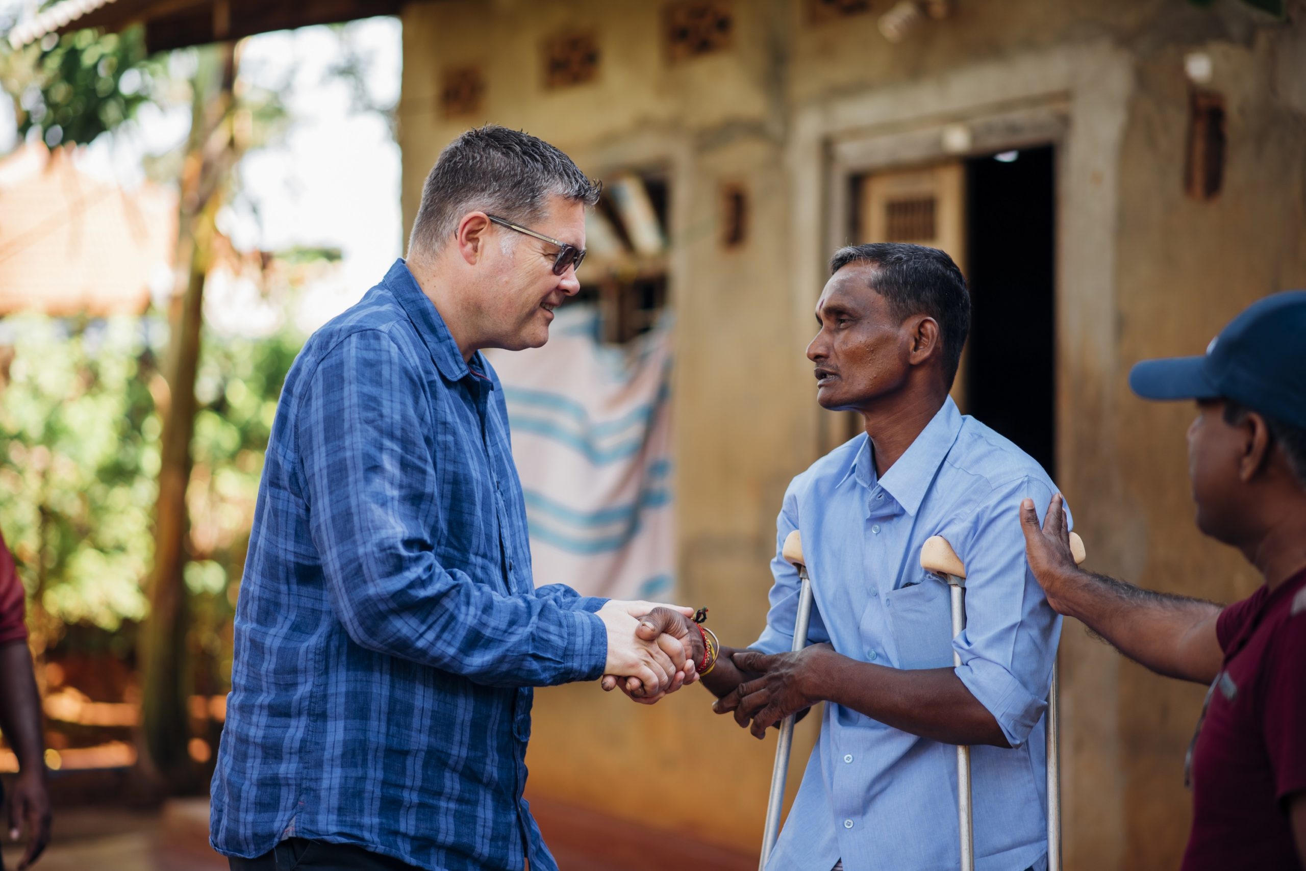 National director of the Leprosy Mission Peter Waddup meets Jegathees, who is cured of leprosy, in Sri Lanka