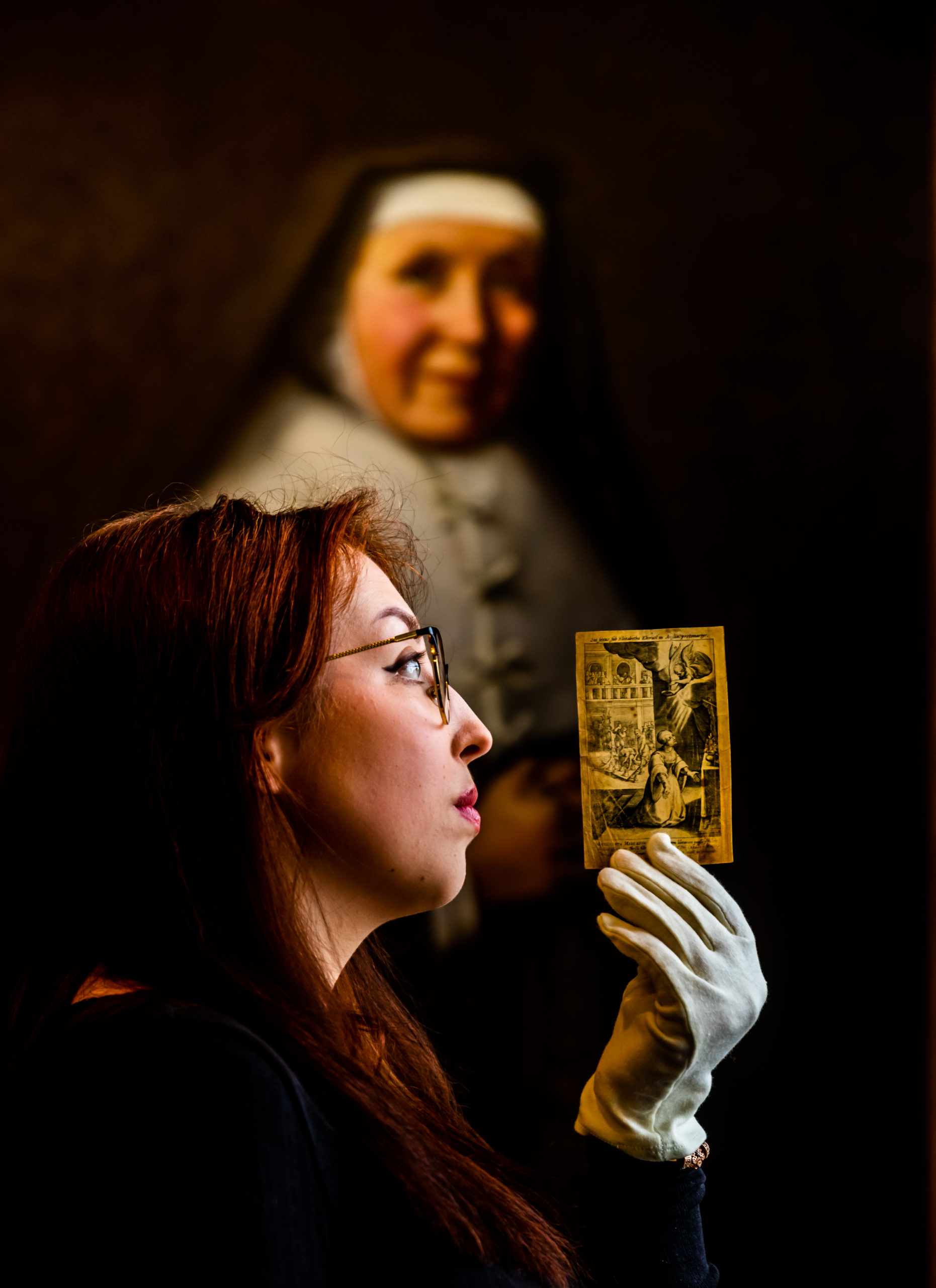York St John University student Jessica Diamond with a 17th-century engraving of St Margaret Clitherow's death