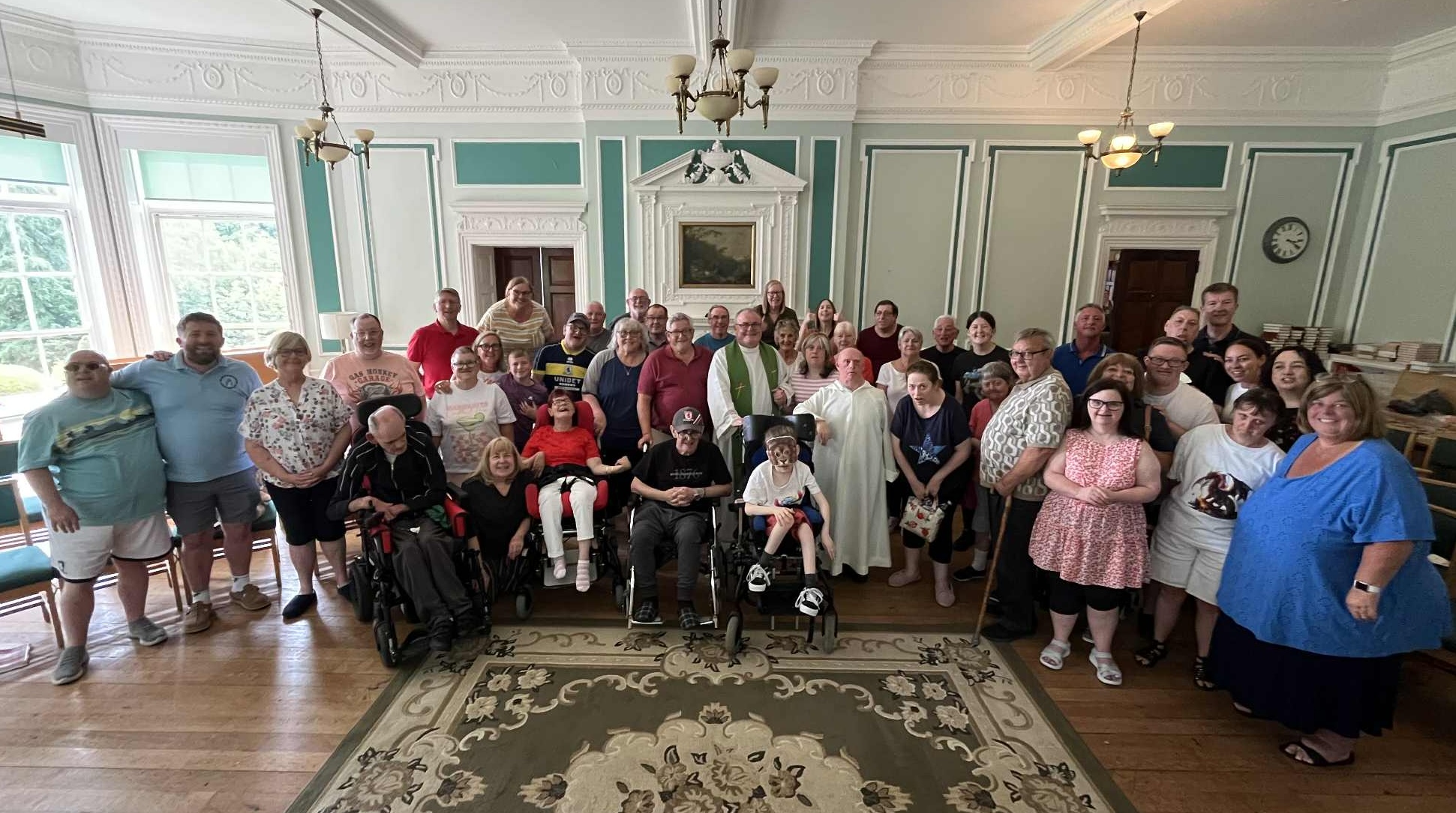 Canon John Lumley with Catholic Fellowship helps and members after saying Mass during their 2025 summer holiday
