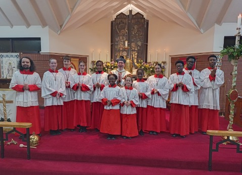 The Easter Vigil sanctuary party and Father Whitwell at St Francis of Assisi Catholic Church, Beeston, in the Diocese of Leeds